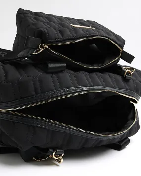 Black quilted travel and makeup bag