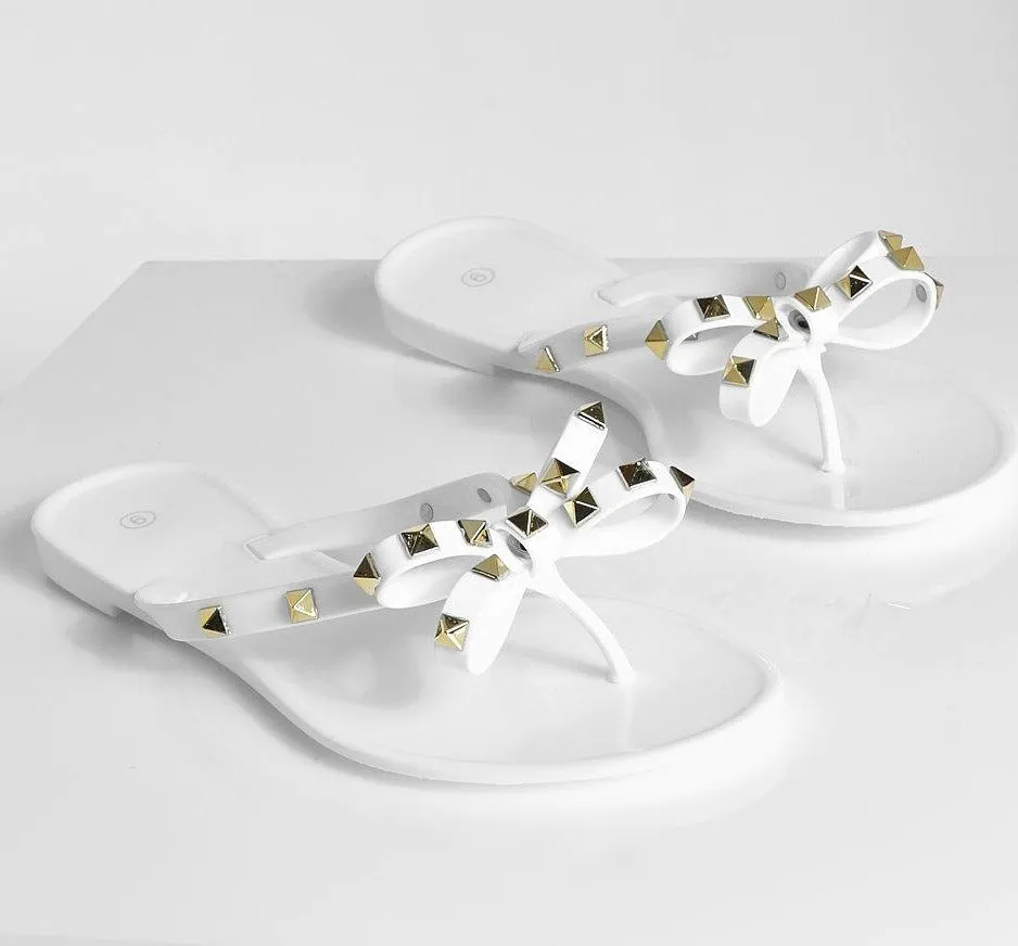 STUDDED BOW JELLY THONG SANDALS